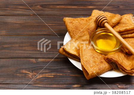 A pile of pancakes, honey, for the celebration 38208517
