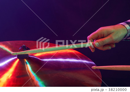 Rock band performs on stage. Guitarist, bass guitar and drums. 38210000