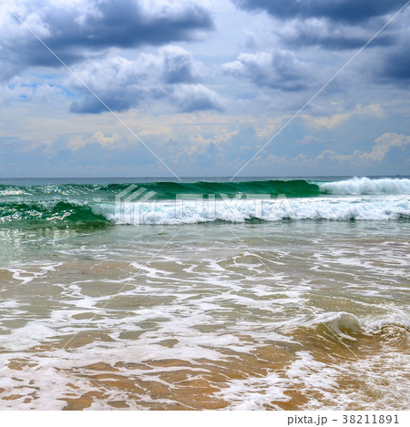 Sandy beach. Dramatic cloudscape Sandy beach. Dramatic cloudscape 38211891