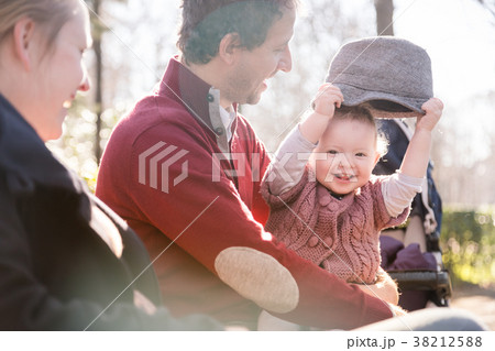 Young family with cheerful child in the park. 38212588