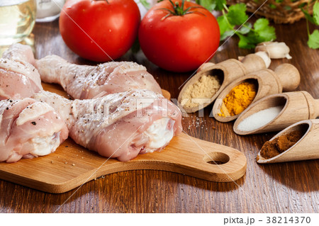 Raw chicken legs with spices Raw chicken legs with spices 38214370