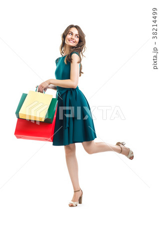 Happy beautiful woman holding many colorful shopping bags isolat Happy beautiful woman holding many colorful shopping bags isolat 38214499