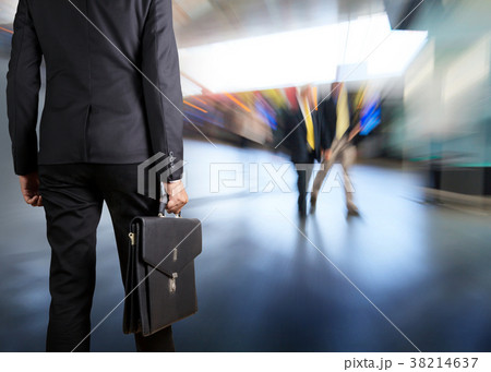 Businessman holding a briefcase Businessman holding a briefcase 38214637
