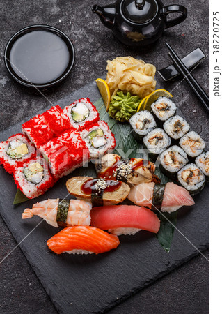 Japanese cuisine. Sushi set over dark background. Japanese cuisine. Sushi set over dark background. 38220725