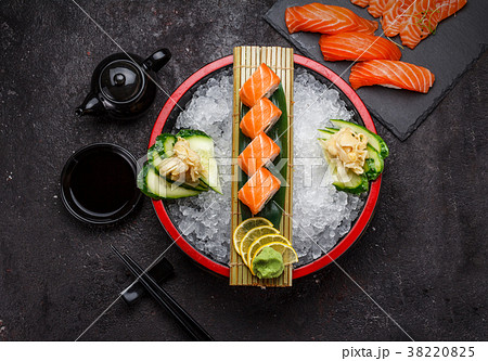 Japanese cuisine. Sushi roll (philadelphia) on ice Japanese cuisine. Sushi roll (philadelphia) on ice 38220825