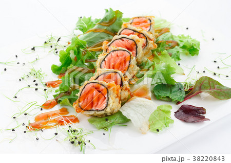 Salmon tempura roll over white background. 38220843