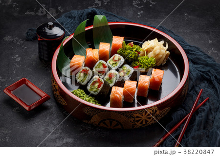Japanese cuisine. Sushi set over dark background. Japanese cuisine. Sushi set over dark background. 38220847