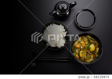 Asian soup and rice for sushi over dark background 38220874