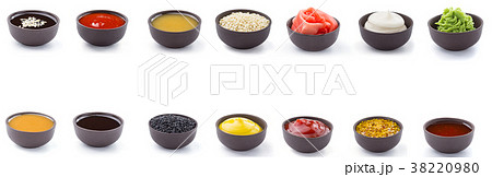 Sauces set in brown bowls isolated on white Sauces set in brown bowls isolated on white 38220980