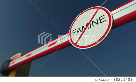 Closed barrier gate with NO FAMINE sign 38221403