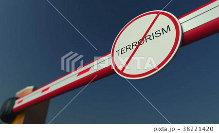 Closed barrier gate with NO TERRORISM sign 38221420