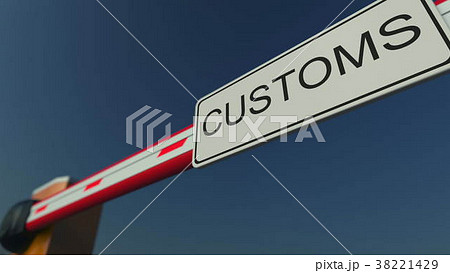 Closed barrier gate with CUSTOMS sign. Conceptual 38221429