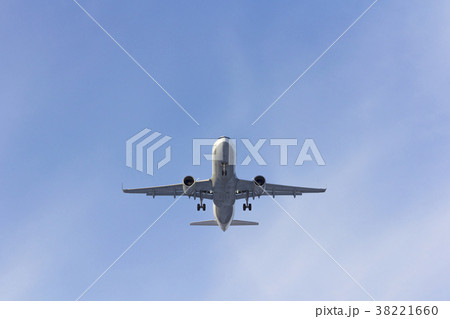 Airplane flies against a background of white cloud Airplane flies against a background of white cloud 38221660