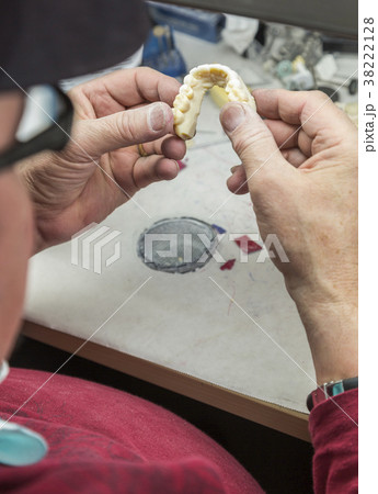 Dental Technician Works On 3D Mold Tooth Implants Dental Technician Works On 3D Mold Tooth Implants 38222128
