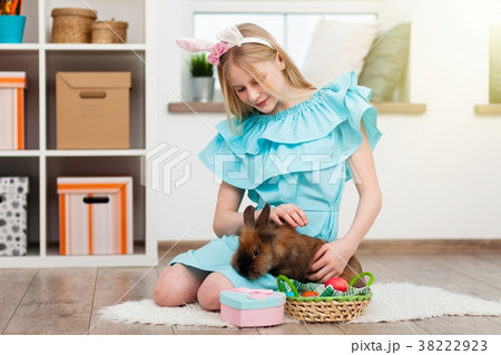 Teenage girl holding Easter eggs Teenage girl holding Easter eggs 38222923
