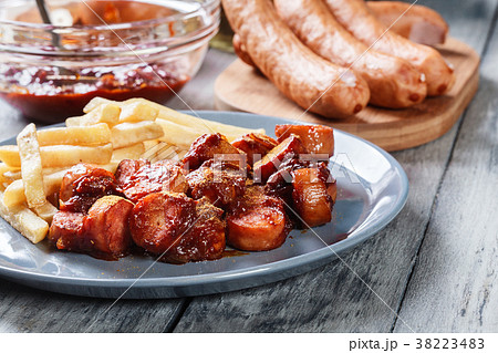 Traditional German currywurst - pieces of sausage Traditional German currywurst - pieces of sausage 38223483