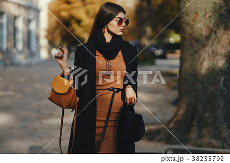 stylish girl walking through the city stylish girl walking through the city 38233792