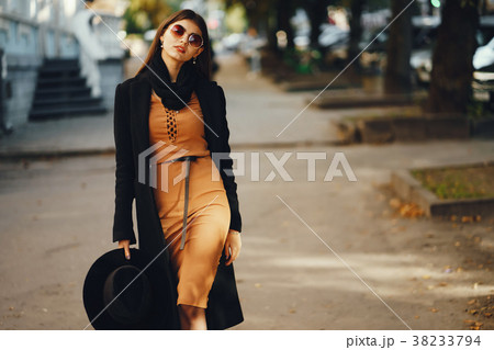 stylish girl walking through the city stylish girl walking through the city 38233794