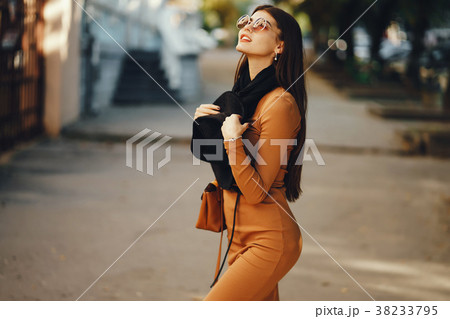 stylish girl walking through the city stylish girl walking through the city 38233795