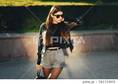 stylish girl walking through the city 38233809