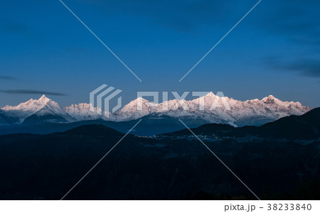 The peak of the Meili mountains at sunrise The peak of the Meili mountains at sunrise 38233840