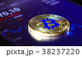 Golden bitcoins on the background of a graphic 38237220