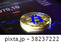 Golden bitcoins on the background of a graphic 38237222