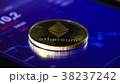 Gold coins of the ethereum on the background of a 38237242