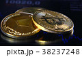 Golden bitcoins on the background of a graphic 38237248