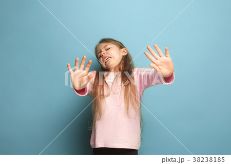 The disgust. Teen girl on a blue background 38238185