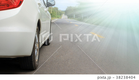 white car and light on asphalt road 38238404
