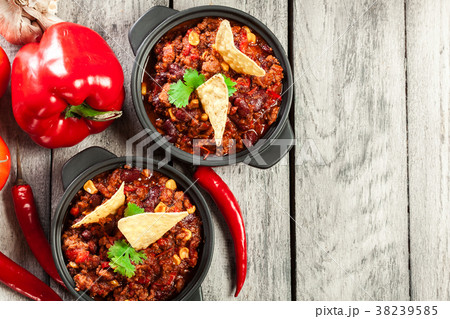 Bowls of hot chili con carne with ground beef 38239585