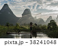 cormorant fisherman throwing netfish in sunset 38241048