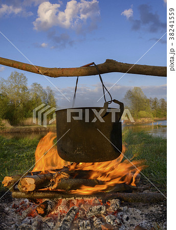Black pot over fire Black pot over fire 38241559