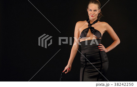 Strict female with leather whip Strict female with leather whip 38242250