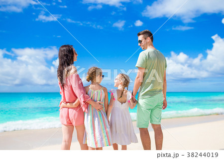 Young family on beach vacation Young family on beach vacation 38244019