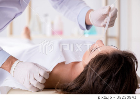 Police coroner examining dead body corpse in 38250943