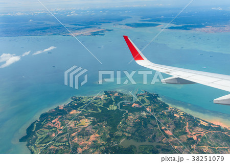 Blue sky ocean/sea and a part of airplane engine 38251079