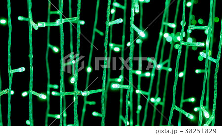 Defocused of green light wires on Christmas tree. Defocused of green light wires on Christmas tree. 38251829