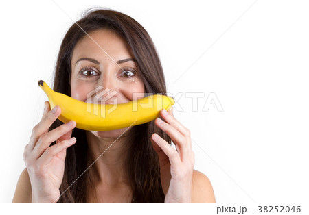 Woman making fun with a banana 38252046
