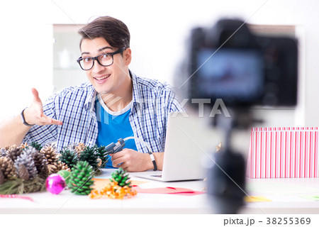 Young vlogger recording video doing christmas 38255369