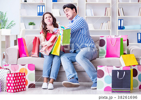 Young pair after shopping with many bags Young pair after shopping with many bags 38261696