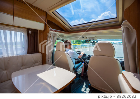 Man driving on a road in the Camper Van RV Man driving on a road in the Camper Van RV 38262032