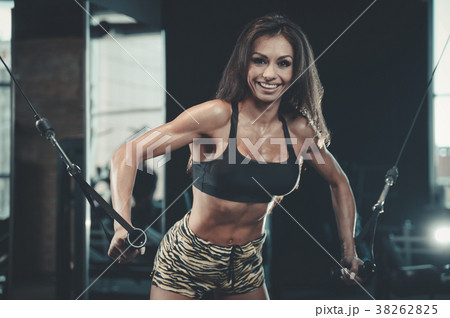 Sexy athletic young girl working out in gym Sexy athletic young girl working out in gym 38262825