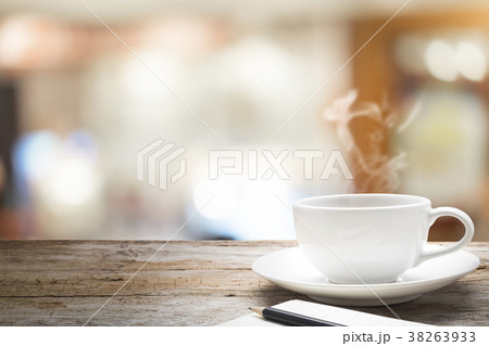 Wooden table with blur background of coffee cafe. 38263933