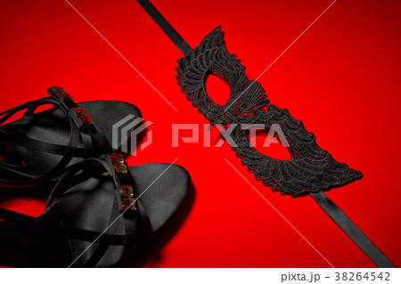 Top view of a sexy black mask and high heels Top view of a sexy black mask and high heels 38264542