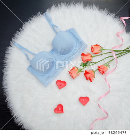 Blue bodice and orange roses with lace on fur 38266473