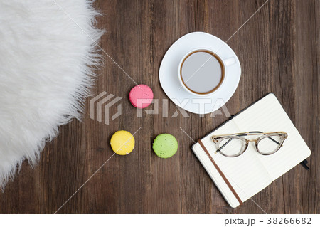 Top view on cup of coffee, macarons, glasses 38266682