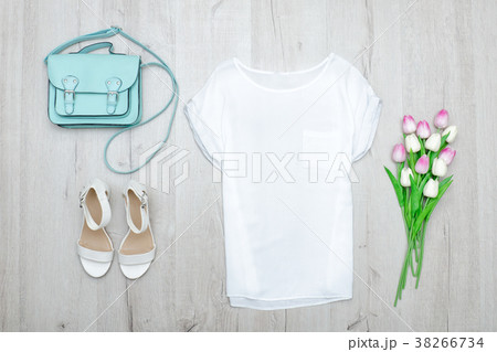 White top, white shoes and a mint bag 38266734