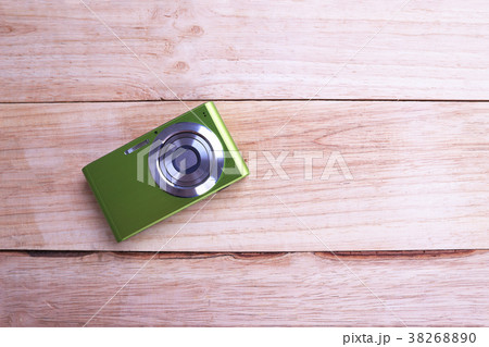 Compact Digital Camera isolated on wooden Compact Digital Camera isolated on wooden 38268890